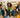oung professionals celebrating Thanksgiving in a decorated office setting, representing fun company culture for modern insurance and workplace teams.